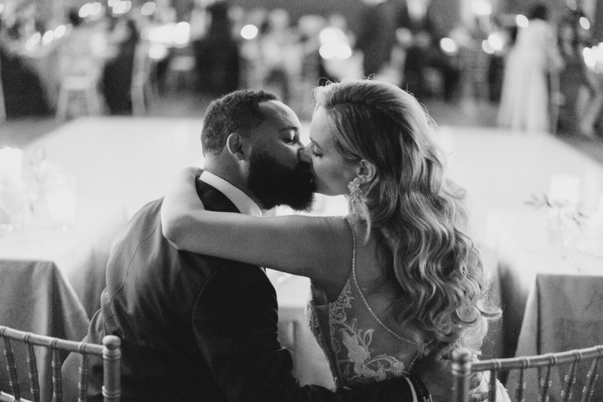 Bride and kiss at elegant reception table at Summerour Studio in Georgia