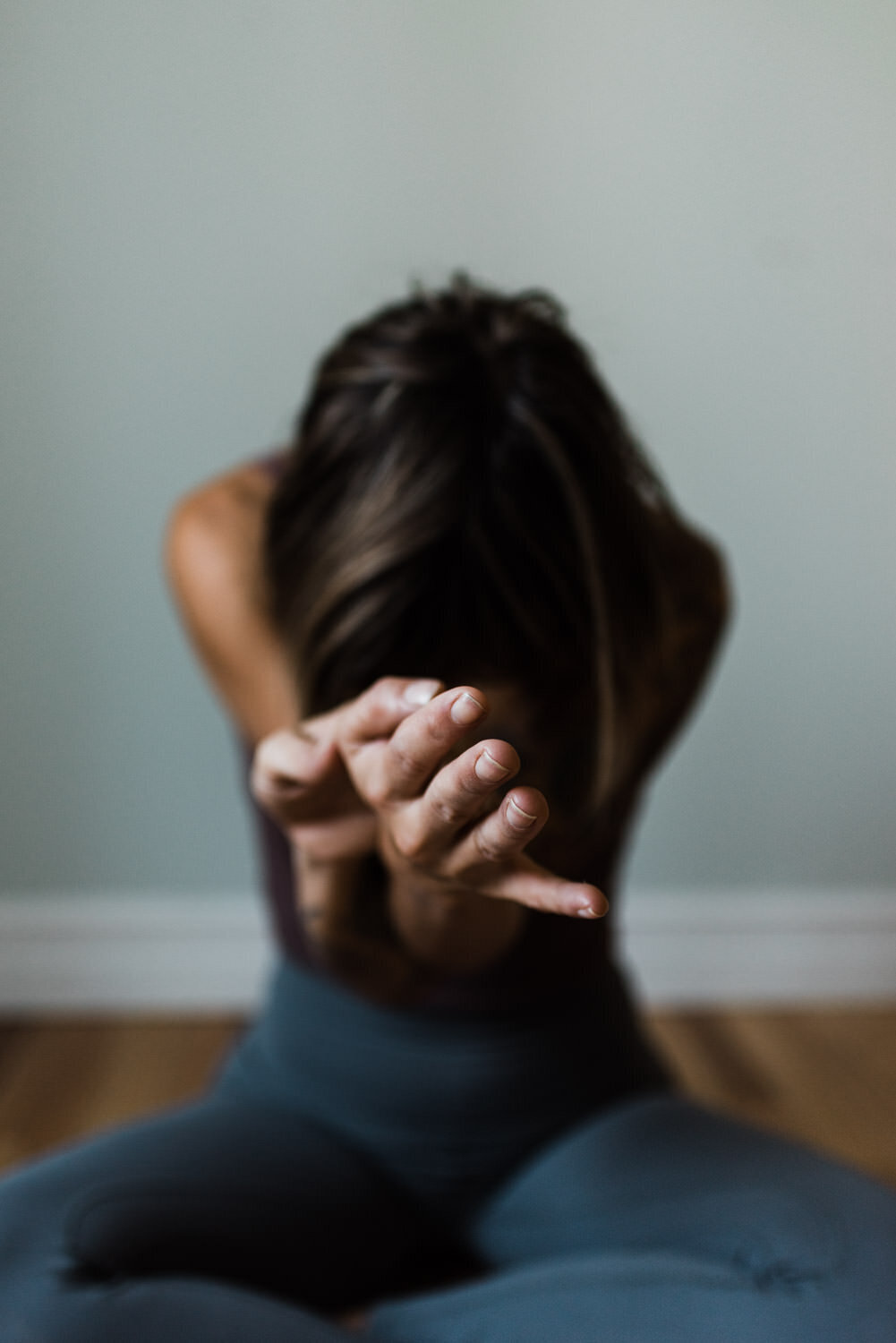 Woman doing yoga during portrait photography session.