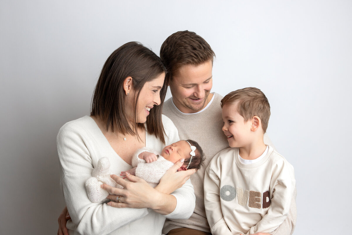 Family studio post with big brother and baby girl