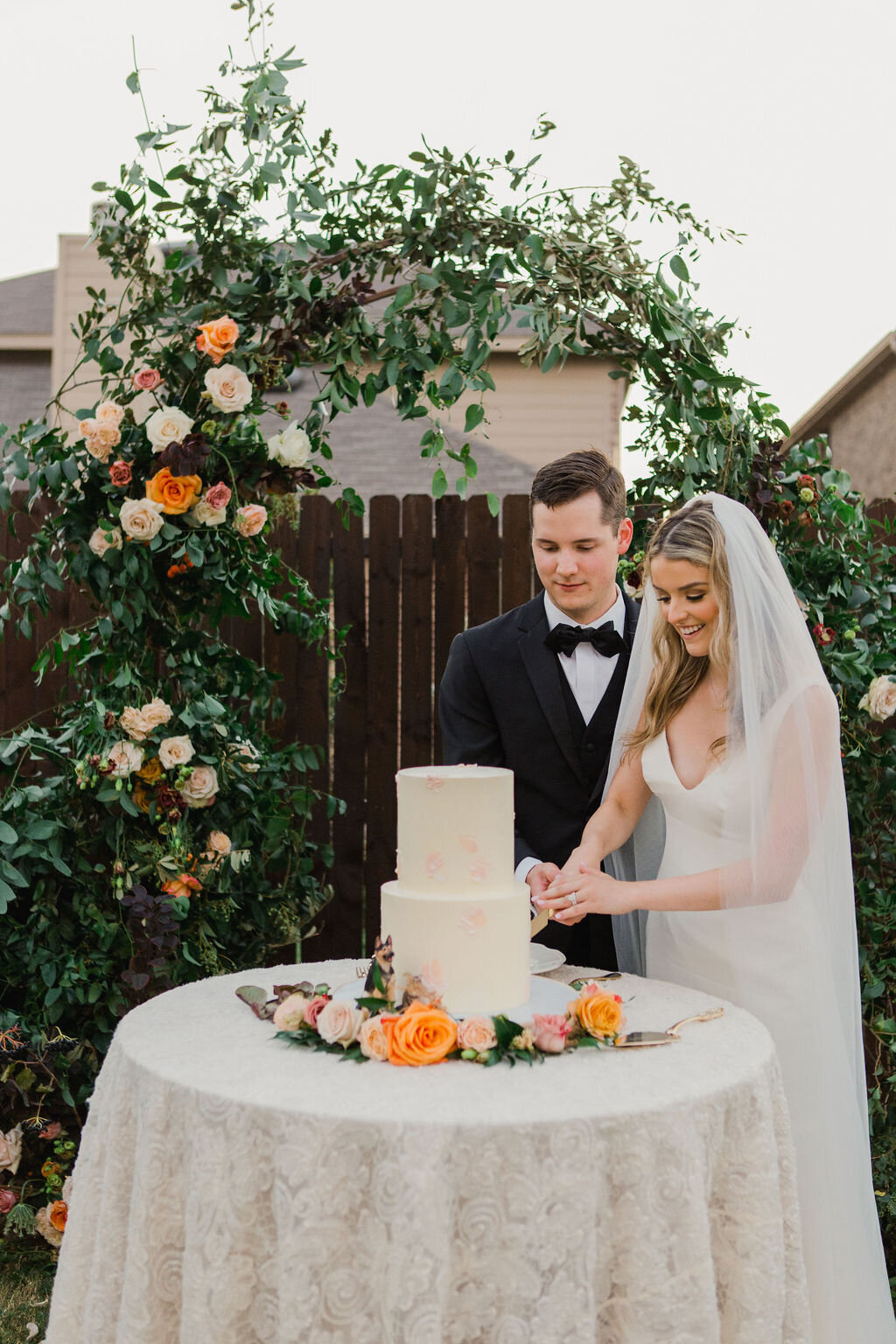 Cake Cutting at Intimate Ceremony in Dallas Forth Worth, Texas with Floral Arch by Vella Nest Floral Design