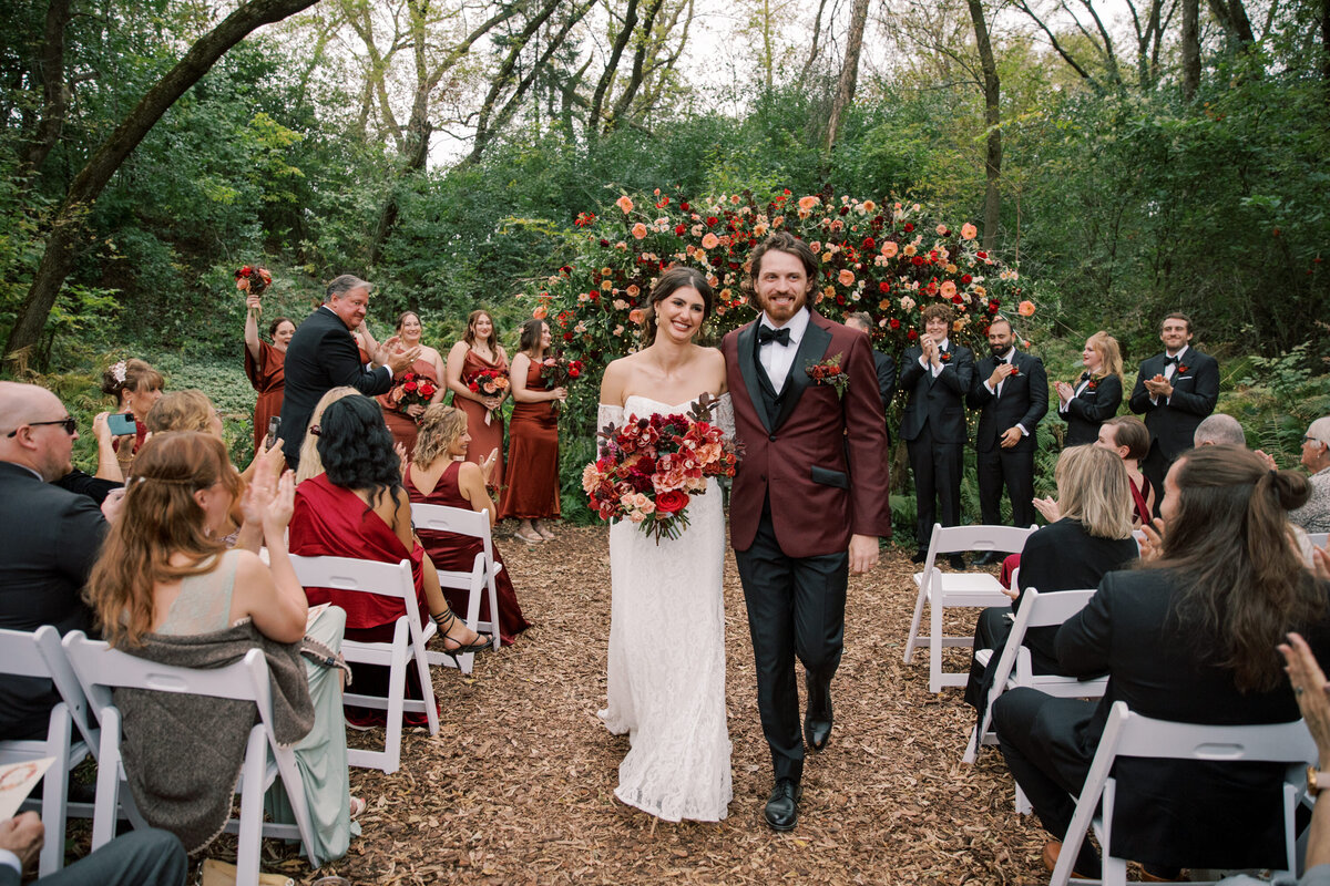 bride and groom walking down the isle