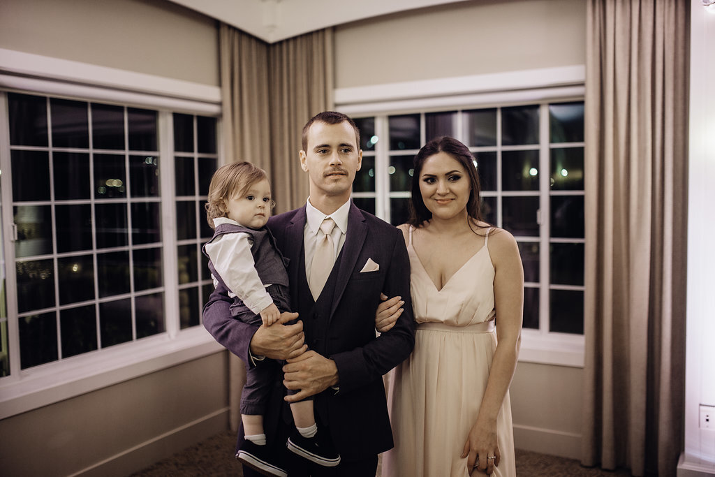 Wedding Photograph Of Man Carrying a Toddler Beside a Woman Los Angeles