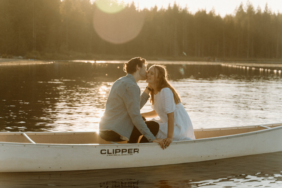 engagement photos in a canoe at golden hour