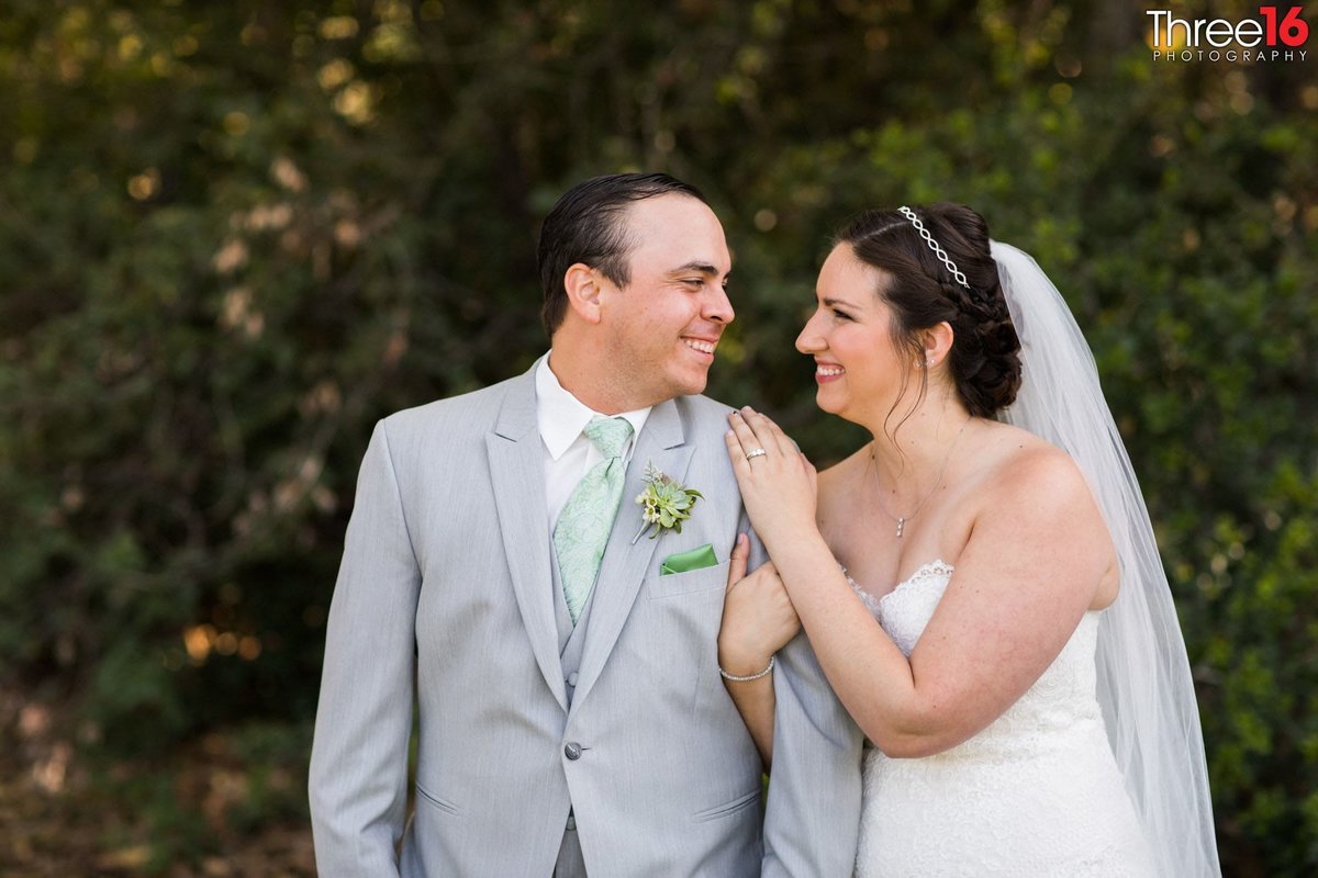 Newly married couple gaze into each other's eyes