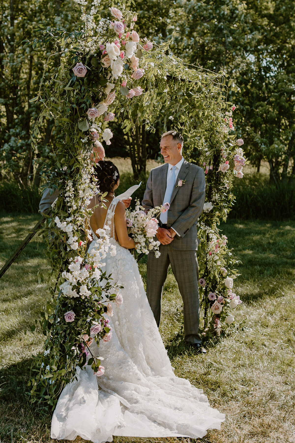 wedding-ceremony-vows-sunlight-emerald-hills-events-promise-city-iowa-des-moines-wedding-photographer-storyteller-collective-photo-co
