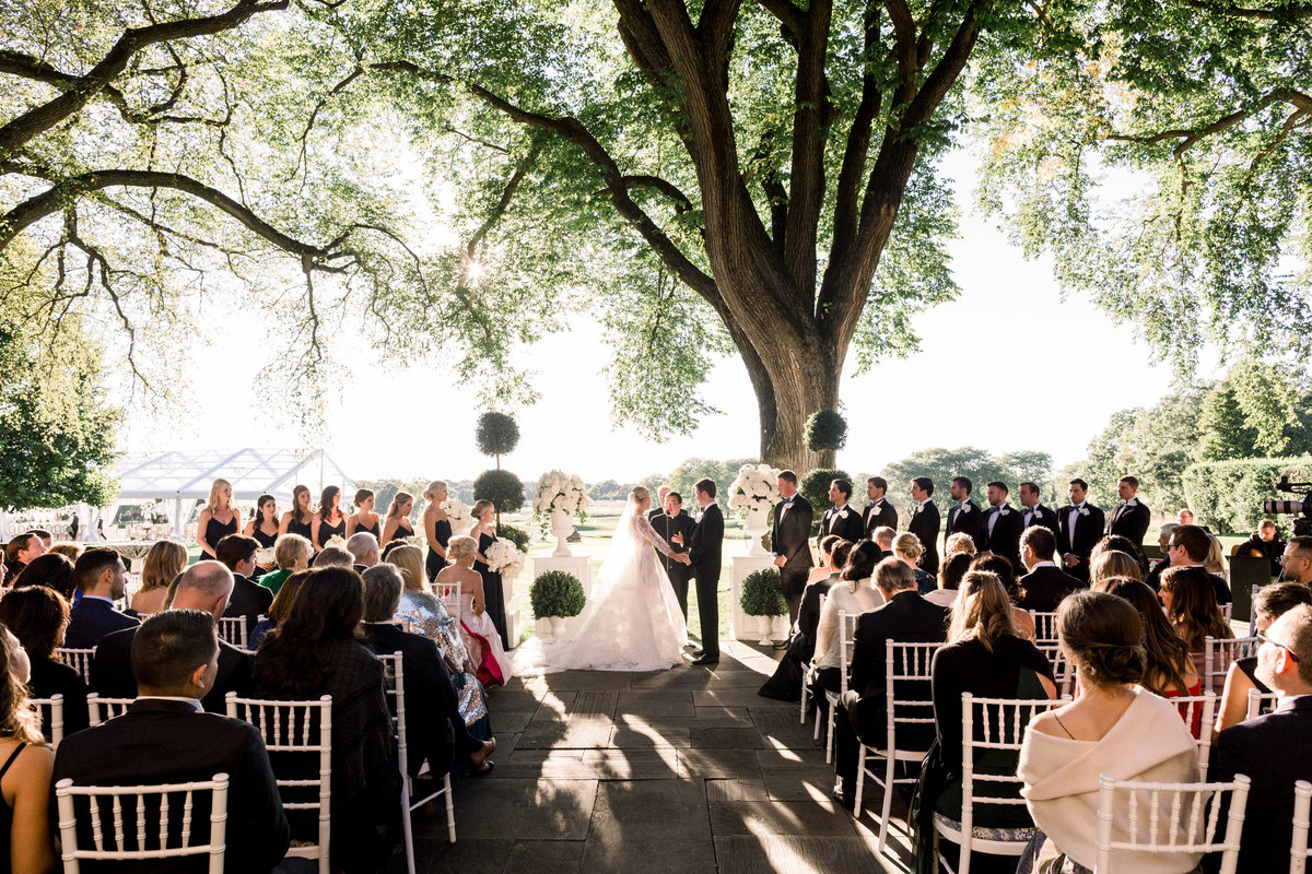 A shot of the wedding ceremony at the Onwentsia country club.
