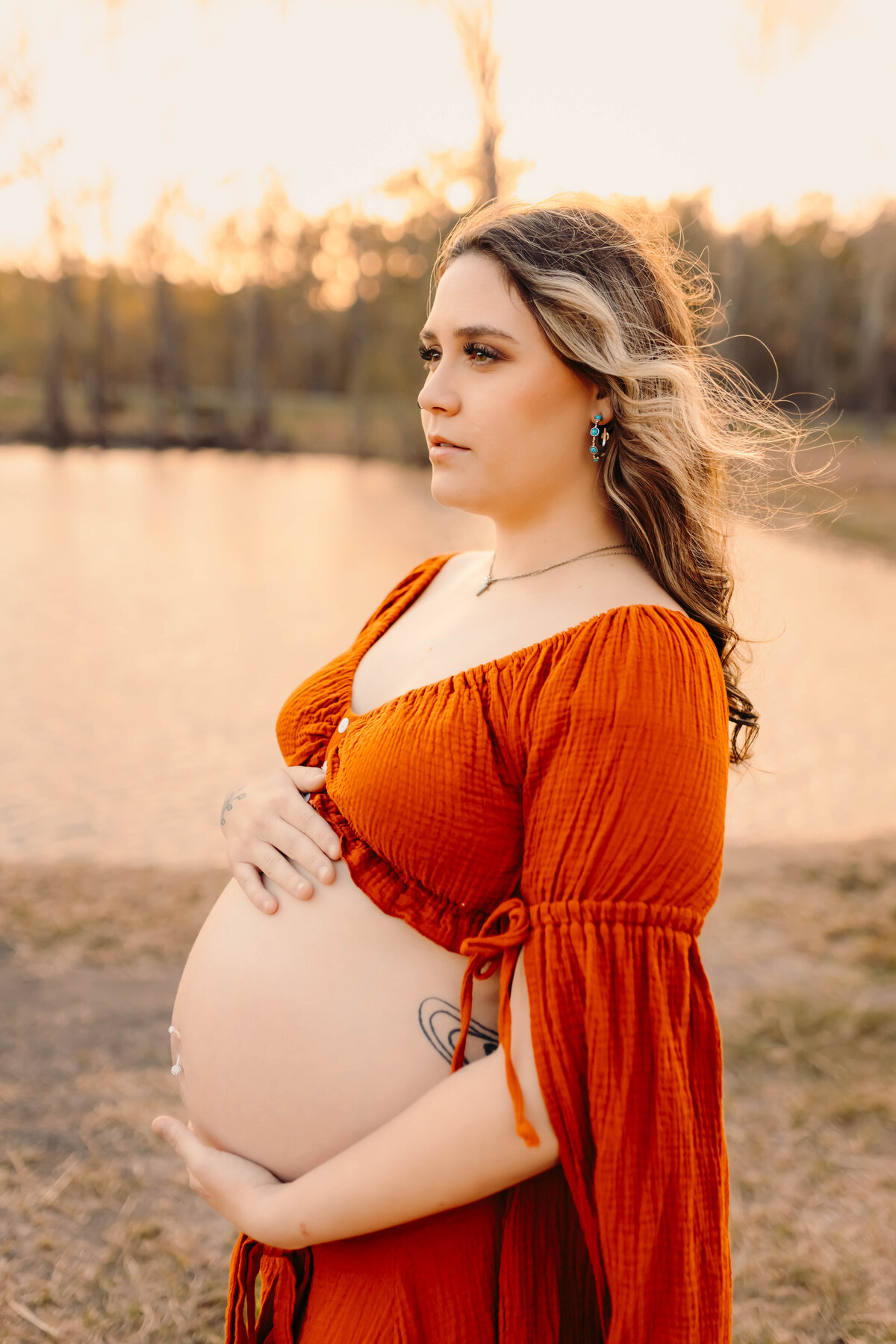 Livingston TX maternity session—close-up profile of pregnant woman with hair blowing