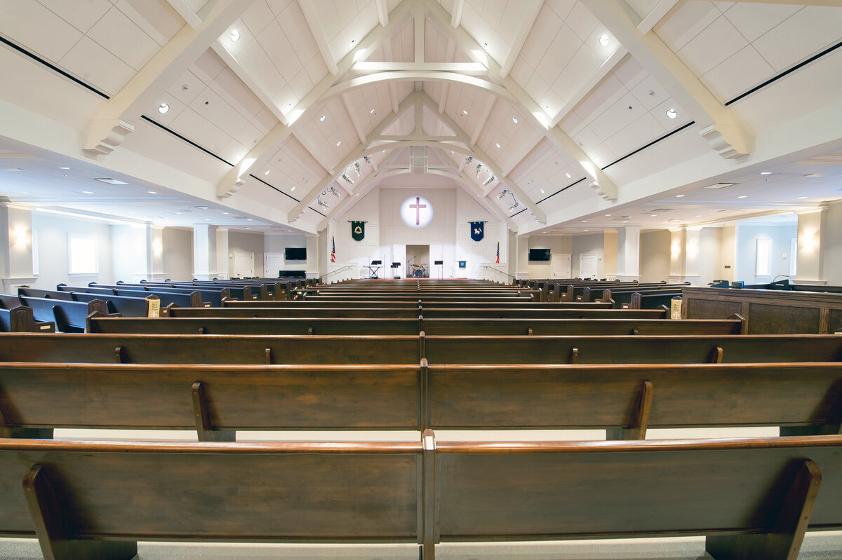 view of the vaulted ceiling and pews inside the chapel at Cleghorn Hall at Wesleyan School