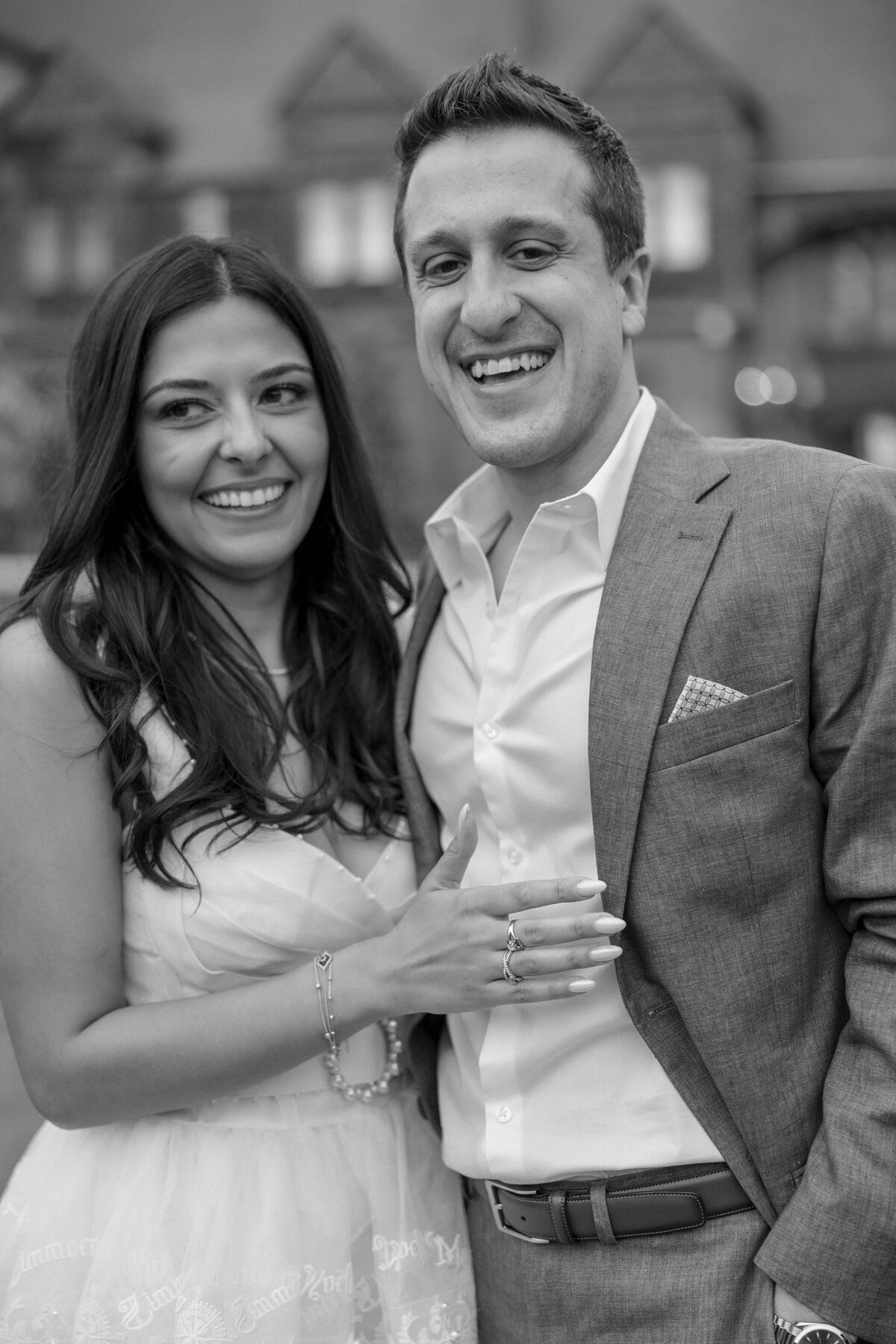 Couple laugh with their guests during welcome party at the Tennis Hall of Fame Newport Rhode Island.