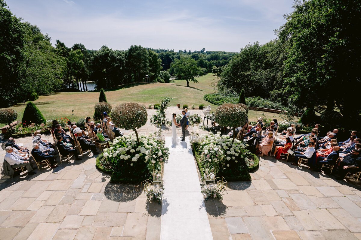 photo taken in the wedding ceremony from above at delamere manor showing the grounds