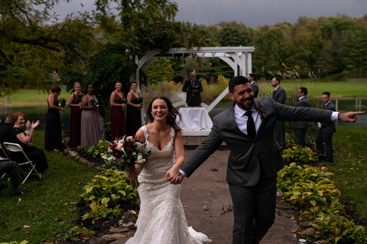 Couple races out of ceremony during recessional to avoid being rained on