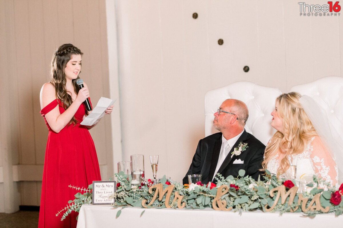 Maid of Honor toasts the newly married couple at the reception