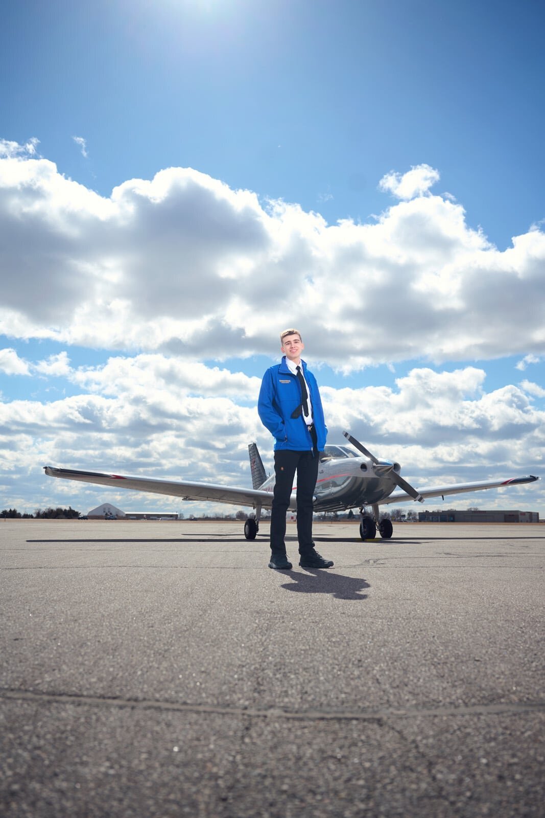 High School Senior Picture Photographer with Airplane and Blue Sky in Minnesota-35