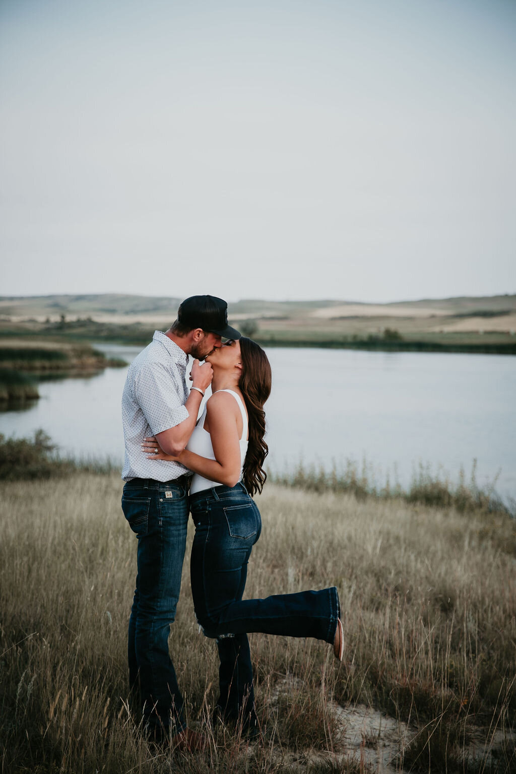 Engagement photography in front of a lake