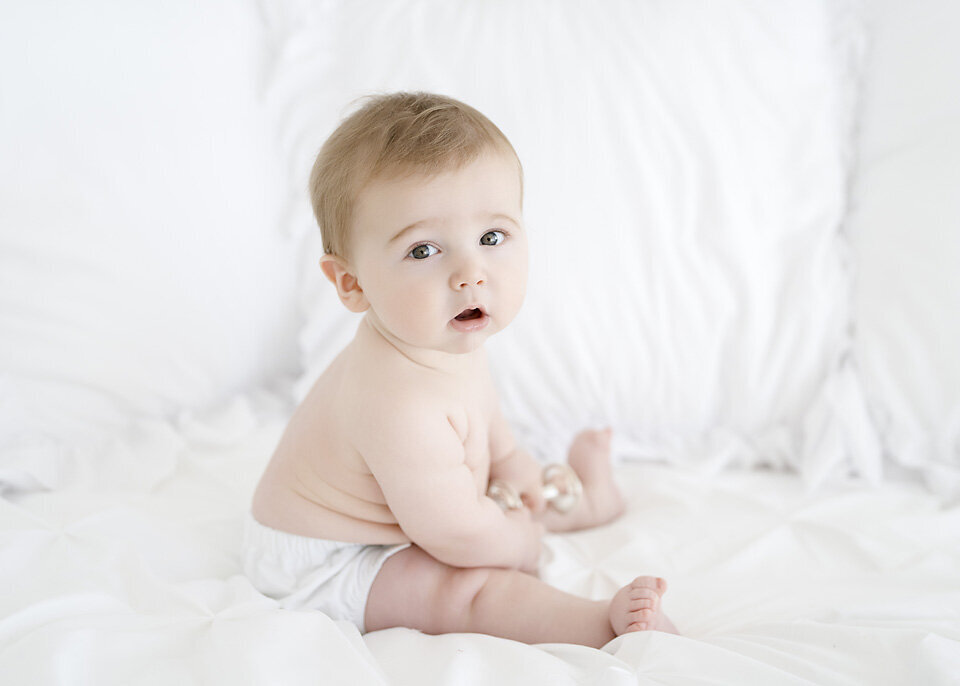 chunky baby boy photogrphaed in a st simons island sutdio for his sitting milestone session