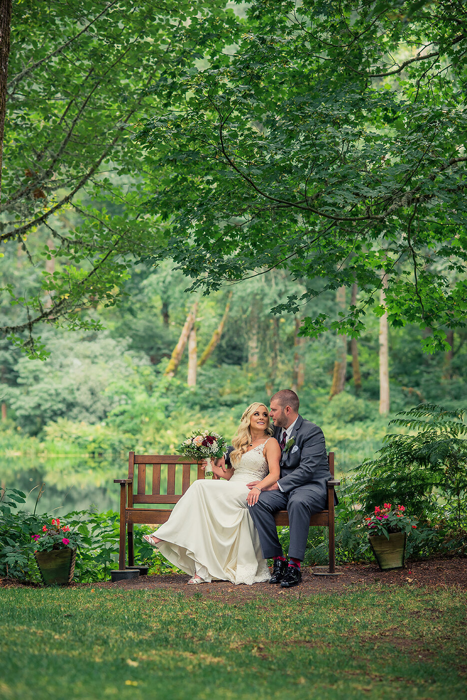 bride and groom on bench