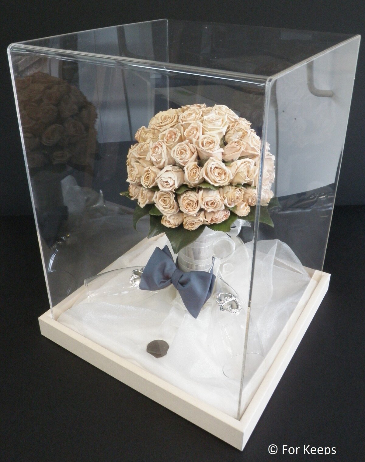 Wedding bouquet preserved inside perspex keepsake.