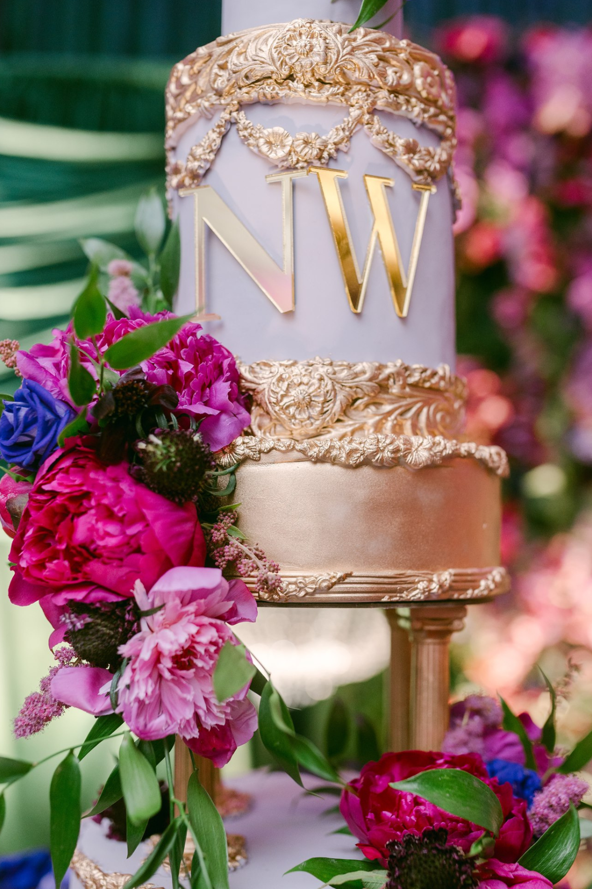 secret-garden-wedding-reception-greenery-pink-purple-gold-cake-gilding
