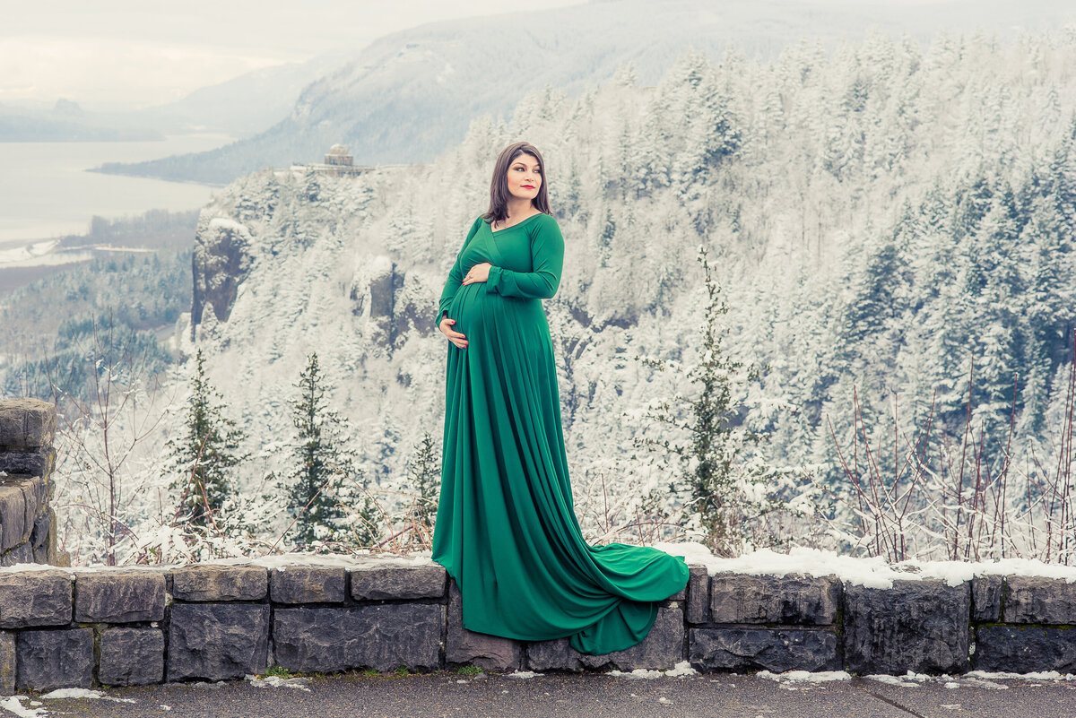 pregnant woman in green posing