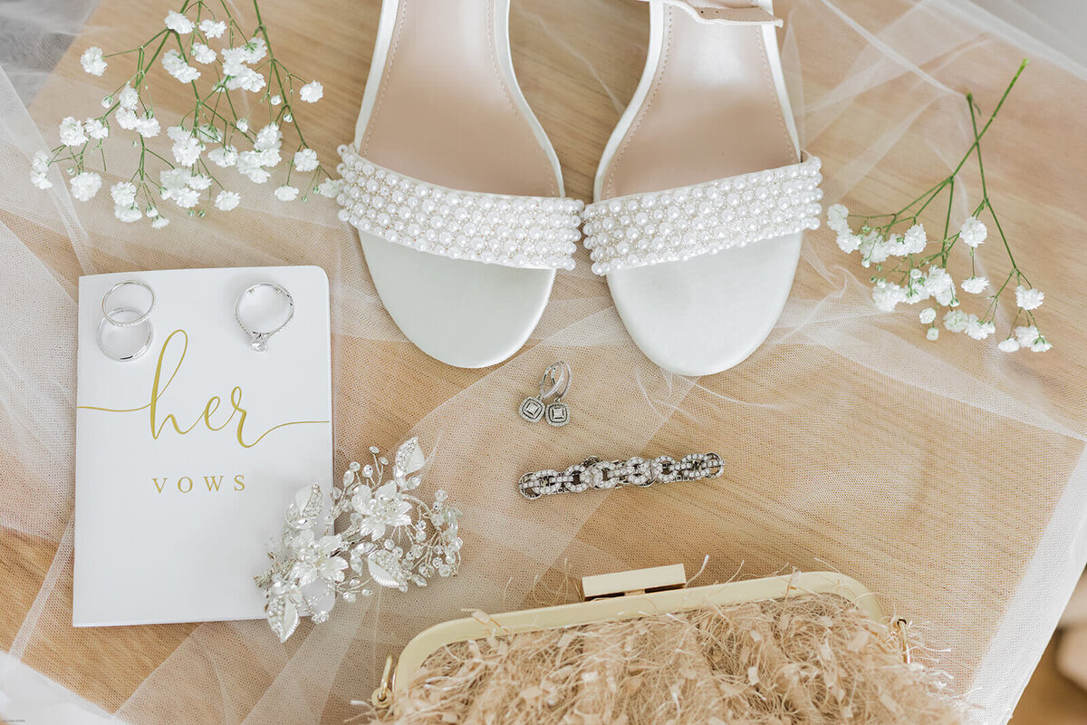 wedding shoes, vow  book and jewelry