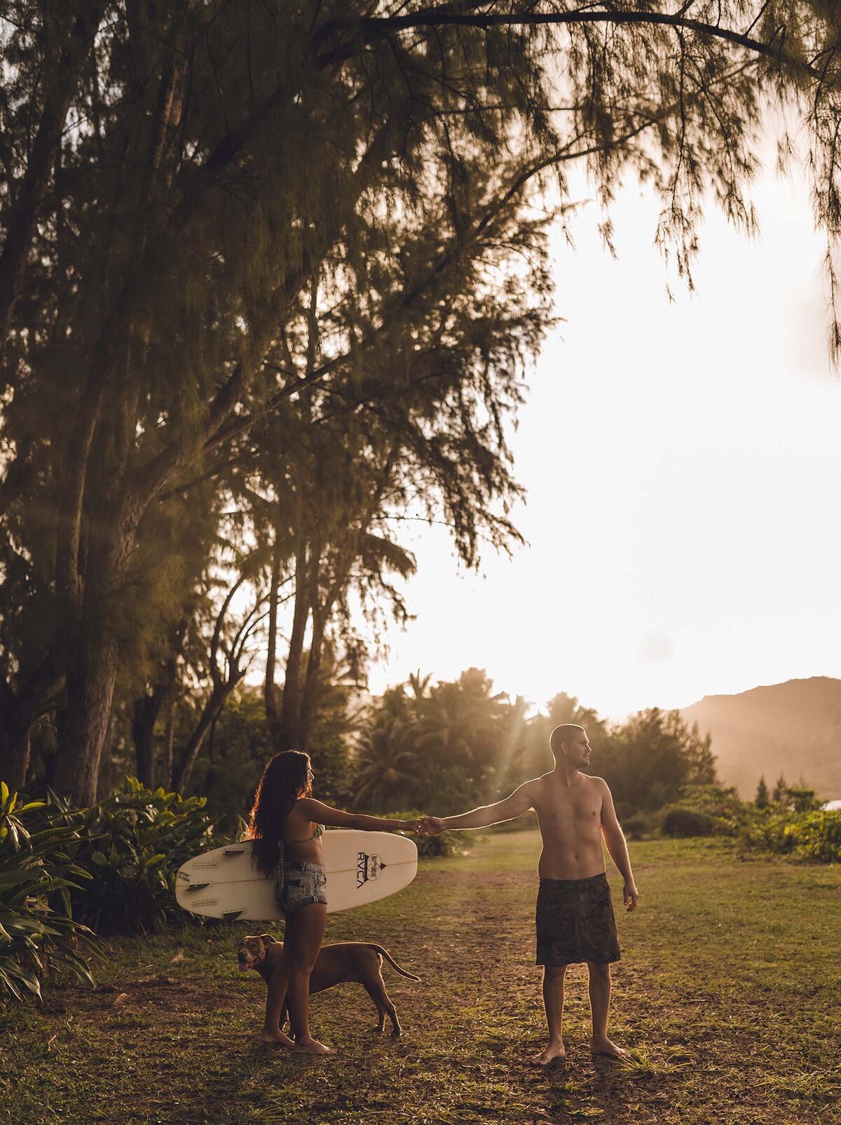 Couple going out to surf