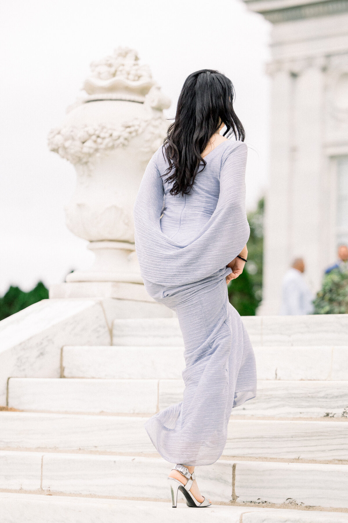 high fashion wedding guest attire in powder bliue gown