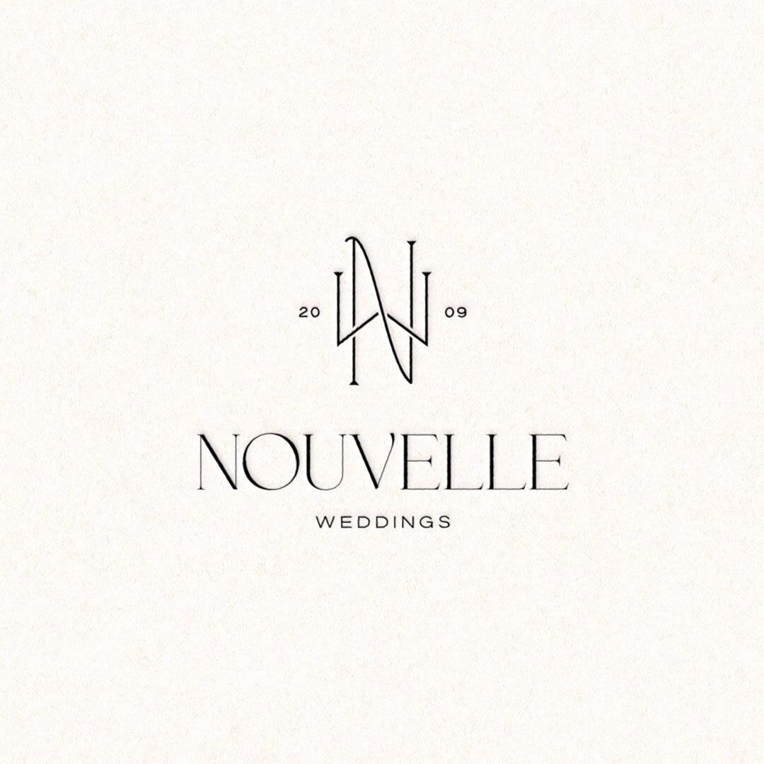 Elegant black-on-cream logo design for Nouvelle Weddings brand identity
