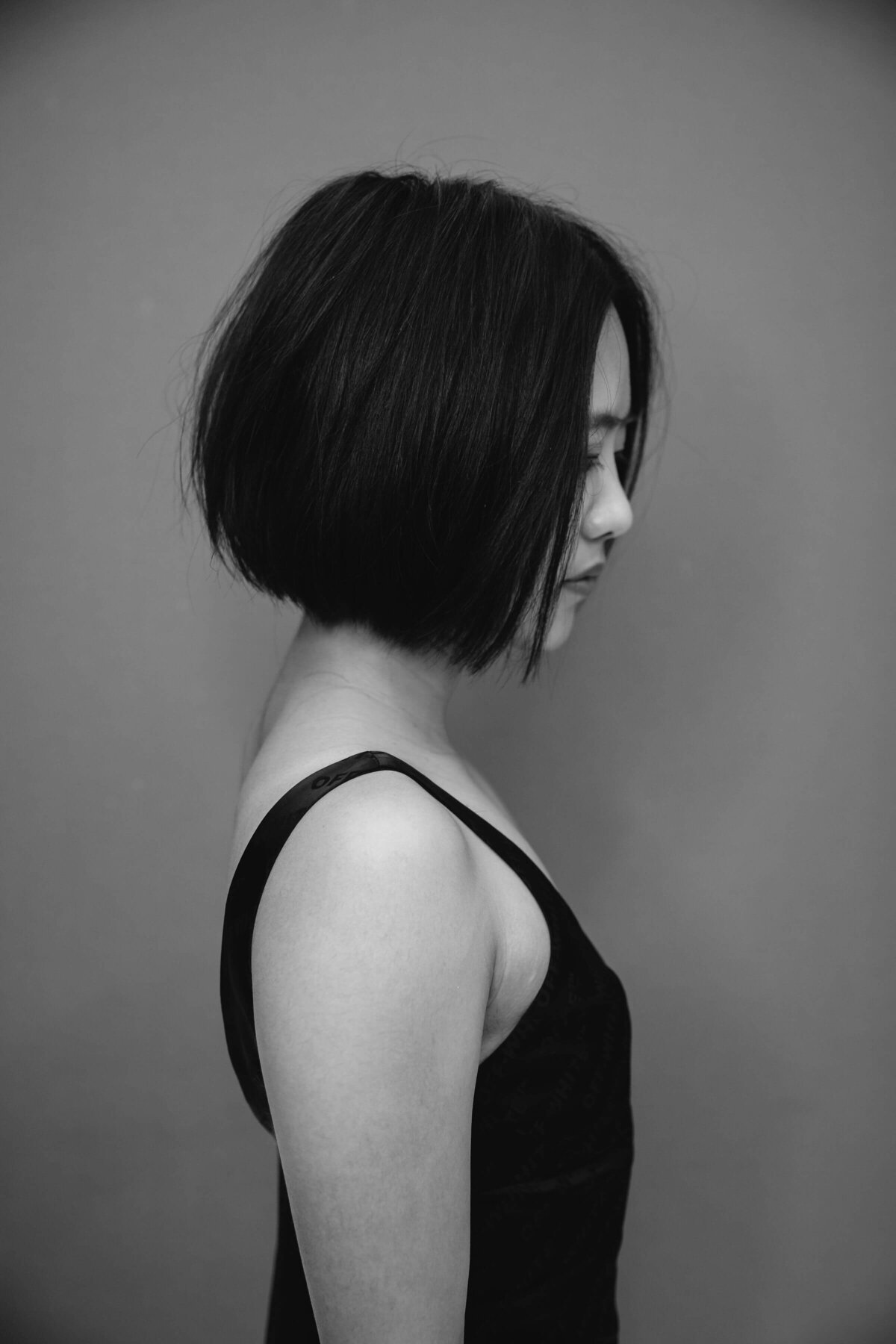 Artisan Salon client modeling their new haircut & style