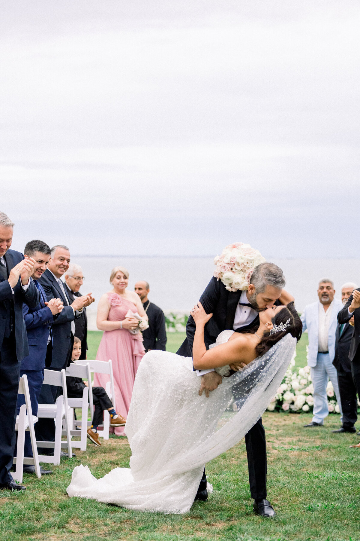 dip kiss at the end of wedding ceremomy at rosecliff mansion in newport rhode island