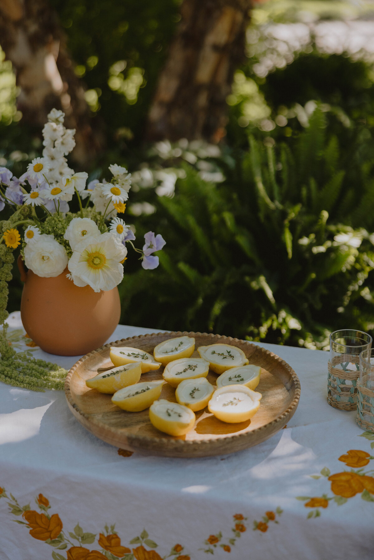 couple walking in a field in the mountains