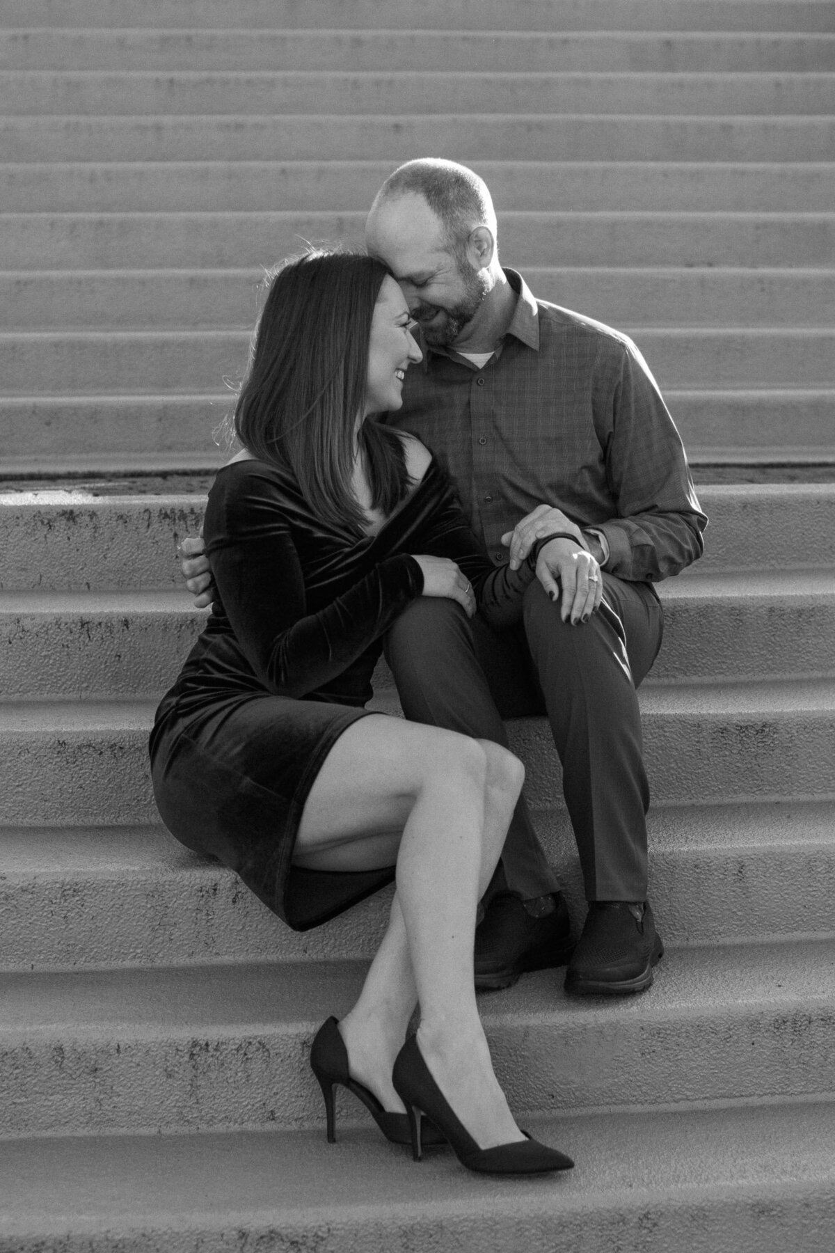 Romantic engagement session at Woodmark hotel in Woodinville WA wedding venue candid black and white happy couple couple laughing photo by Joanna Monger Photography