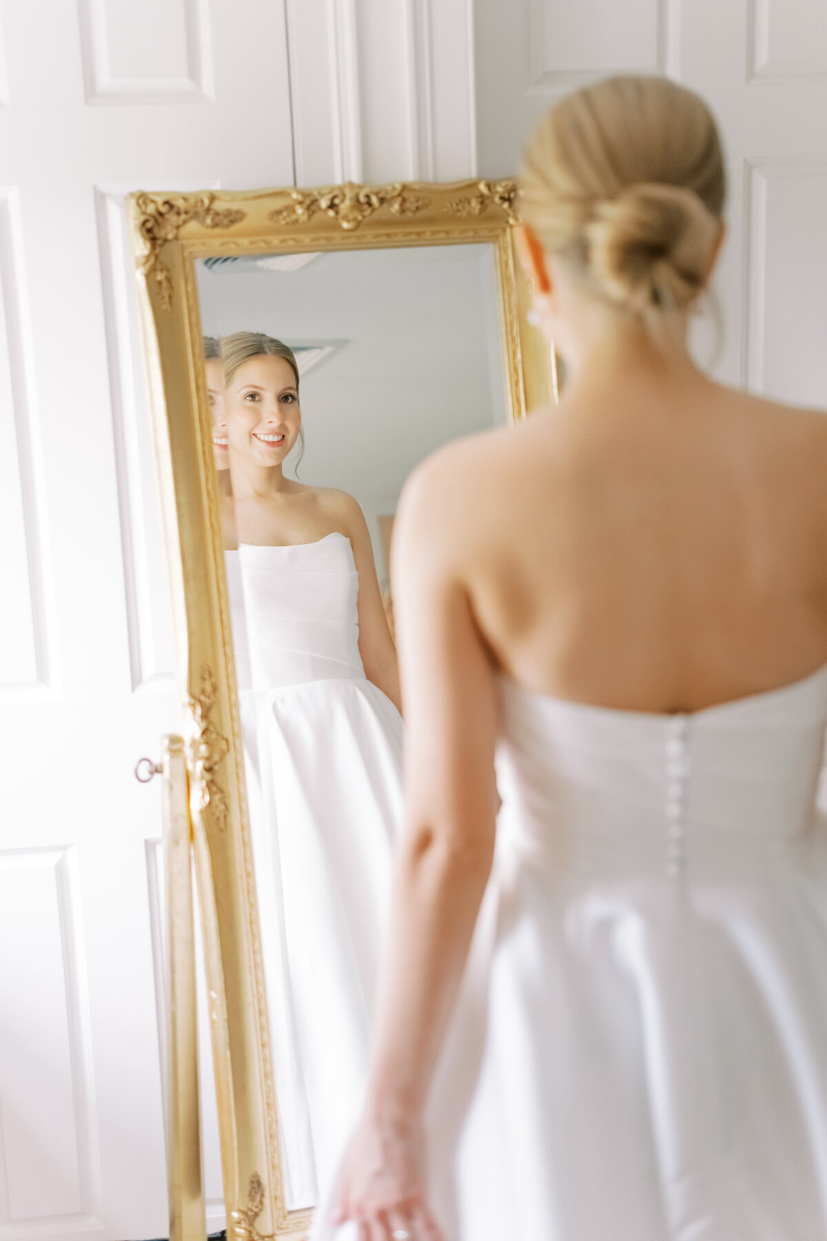 Bride getting dressed at Appleford Estate in Villanova, Pennsylvania