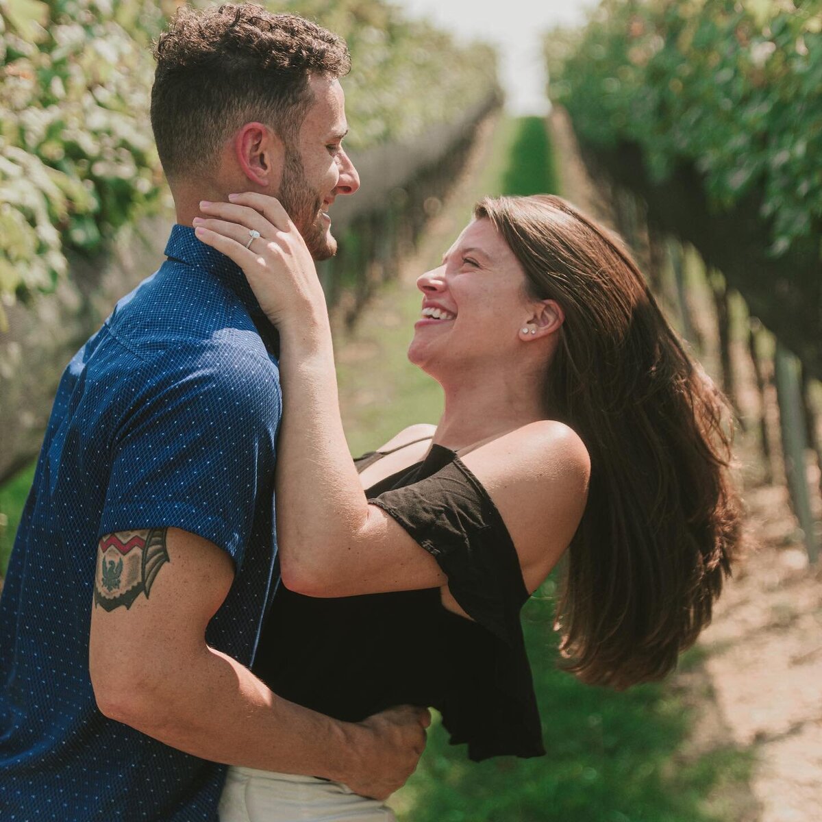A couple celebrating their engagement with a photography shoot in a Lehigh Valley apple orchard.