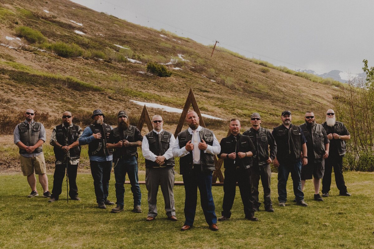 The Groom's motorcycle club stands together at his wedding