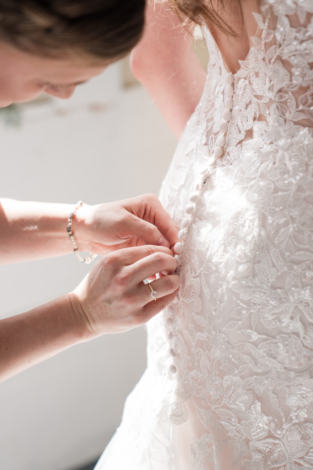 bride-getting-ready-dress-buttons-1
