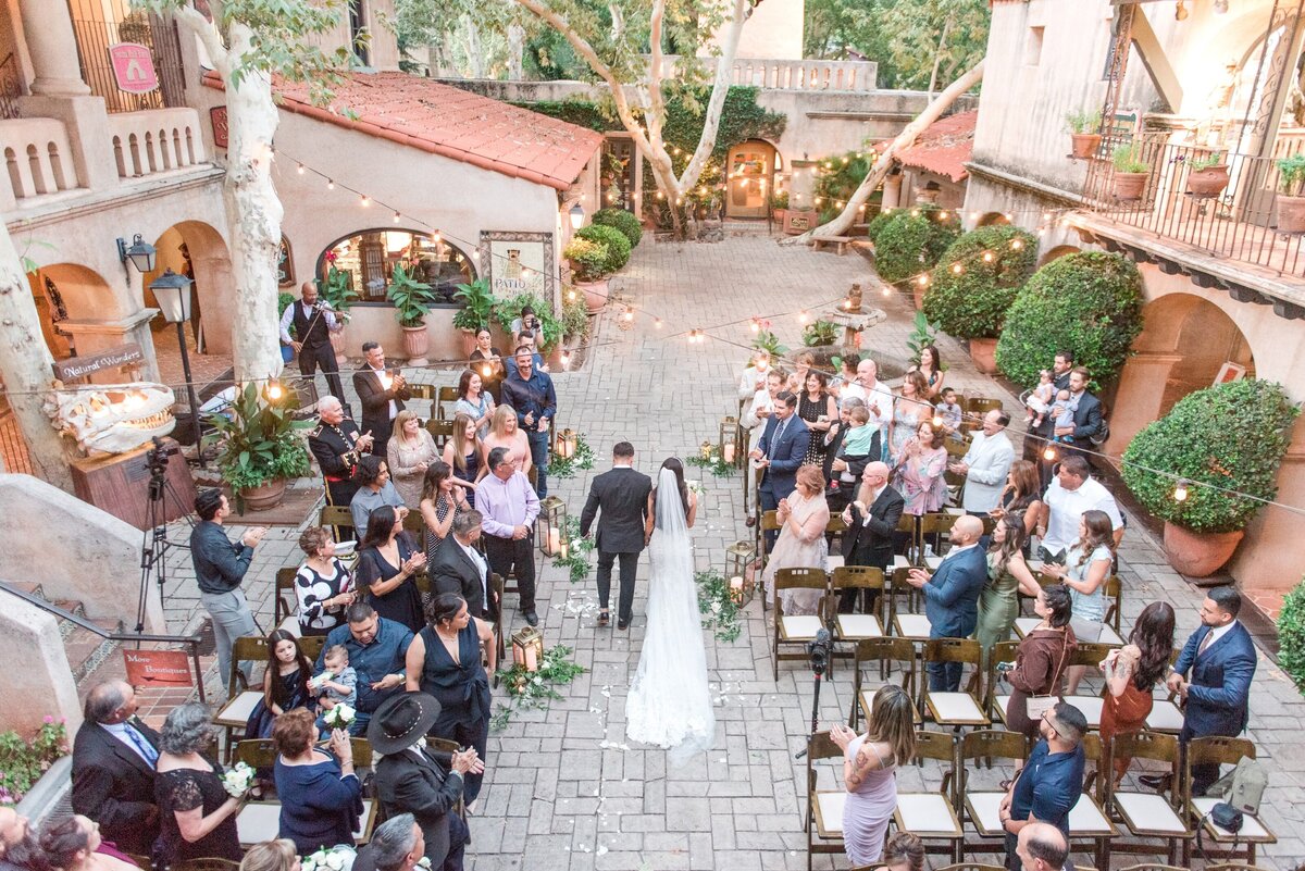 Overhead image of bride and groom walking down the aisle in  outdoor new mexico wedding venue