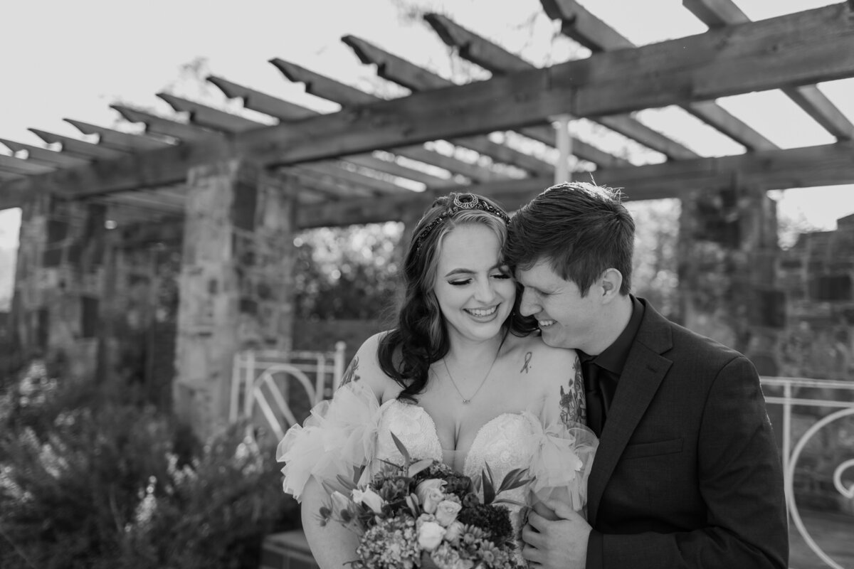 A sweet candid moment of a bride and groom at Weston Gardens in Bloom in Fort Worth Texas. Captured by Fort Worth Wedding Photographer, Megan Christine Studio
