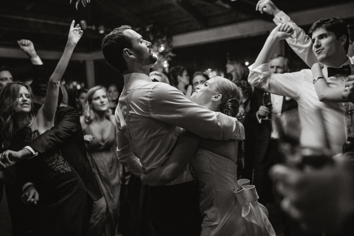 Bride and groom dancing the night away with their loving friends and family at Grace Winery.