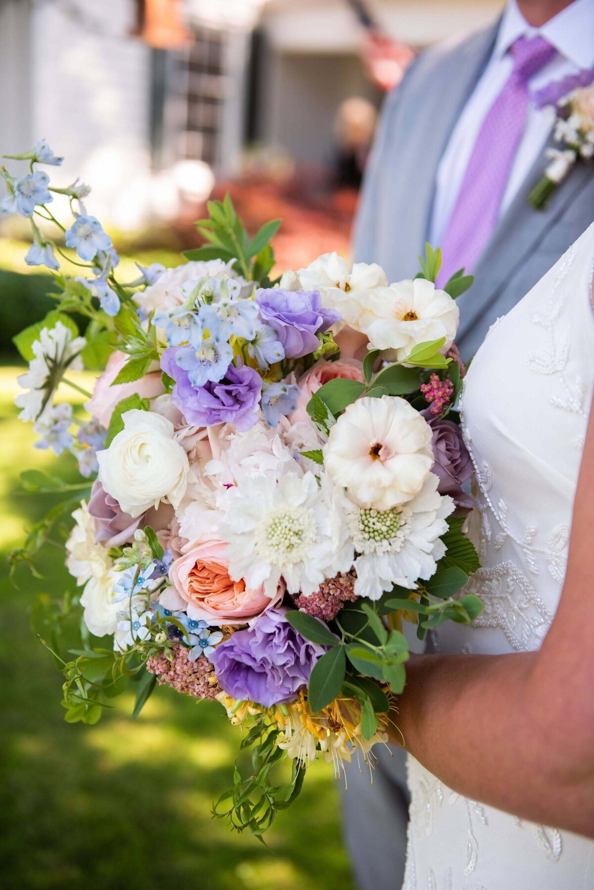 Summer garden bridal bouquet with shades of pink and purple.