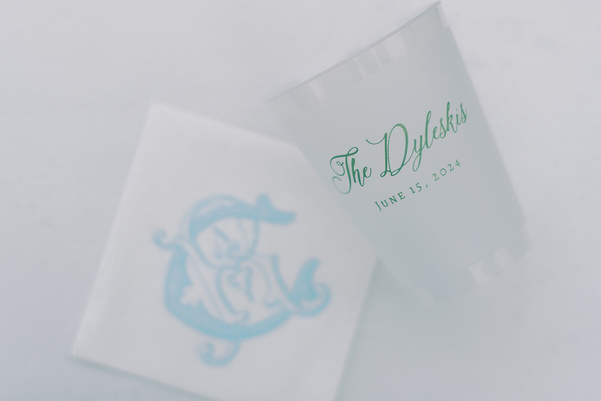 Custom monogram wedding cups and napkins in blue and green for Trillium Links & Lake Club celebration.