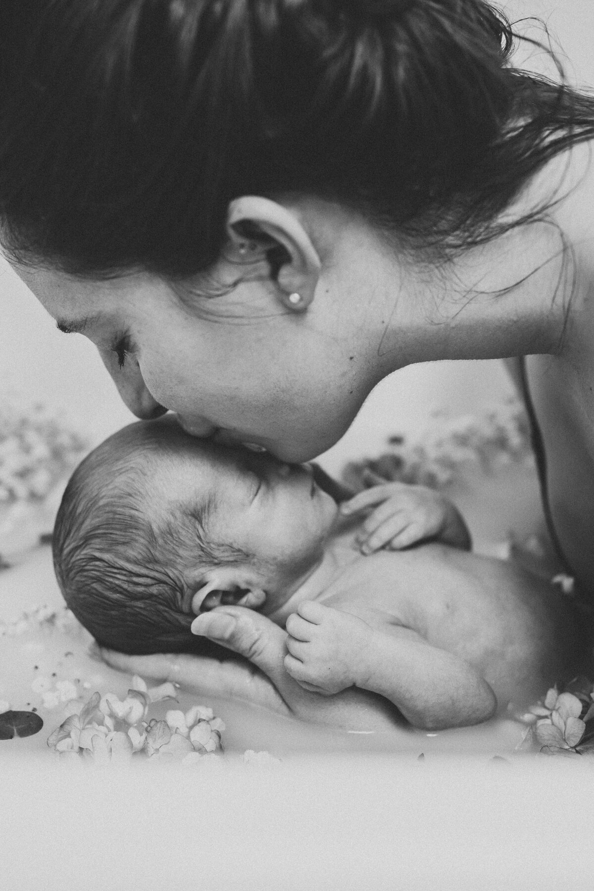 mom-kissing-newborn-baby-boy