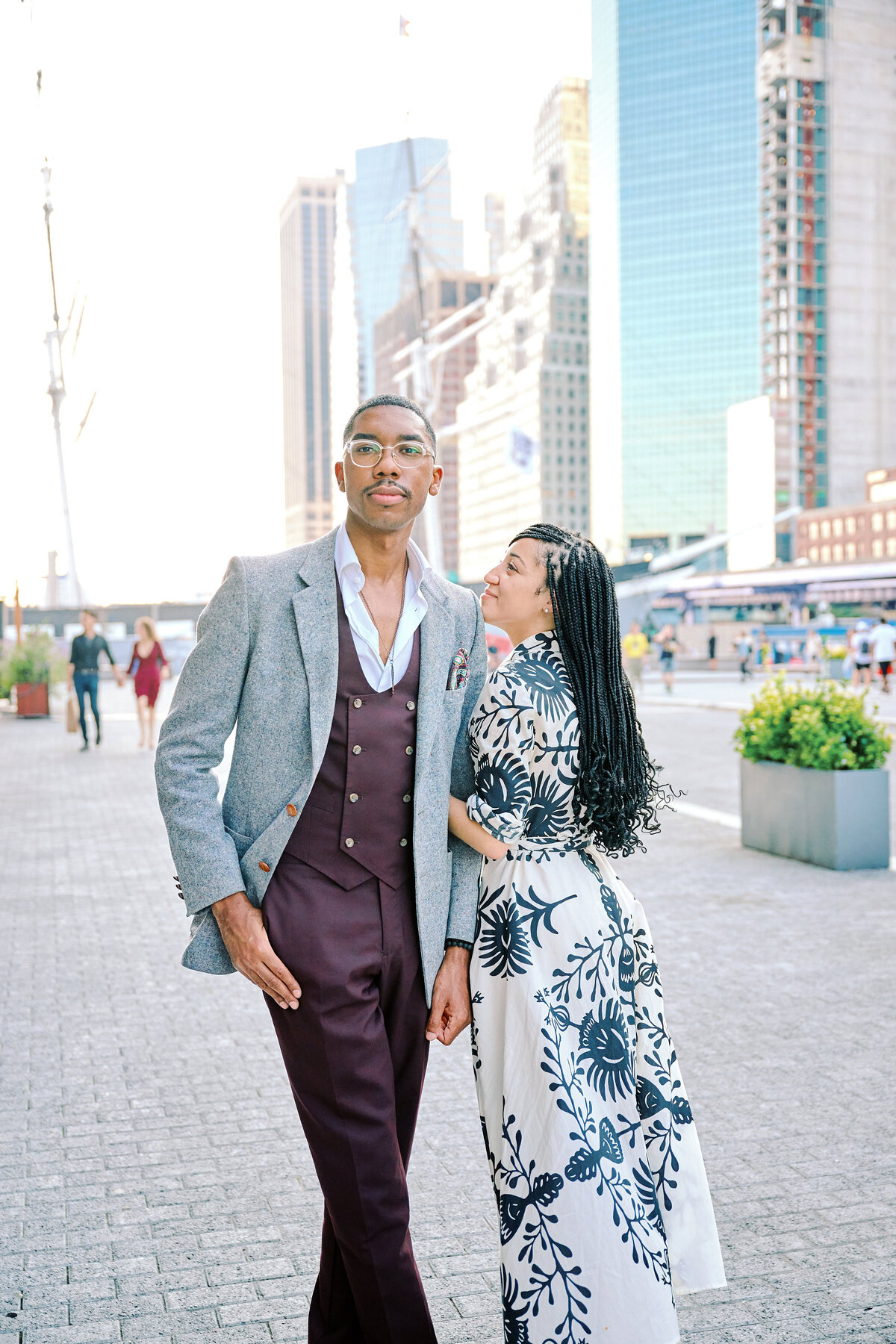 Couple walk together after proposal in South Street Seaport in New York City, New York City Proposal Photographer Corey Lamar Photography