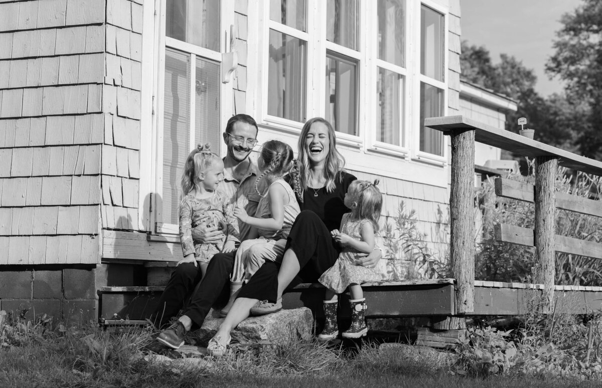 Family sitting on porch together | Family Photography Session Taken By Maine Photographer