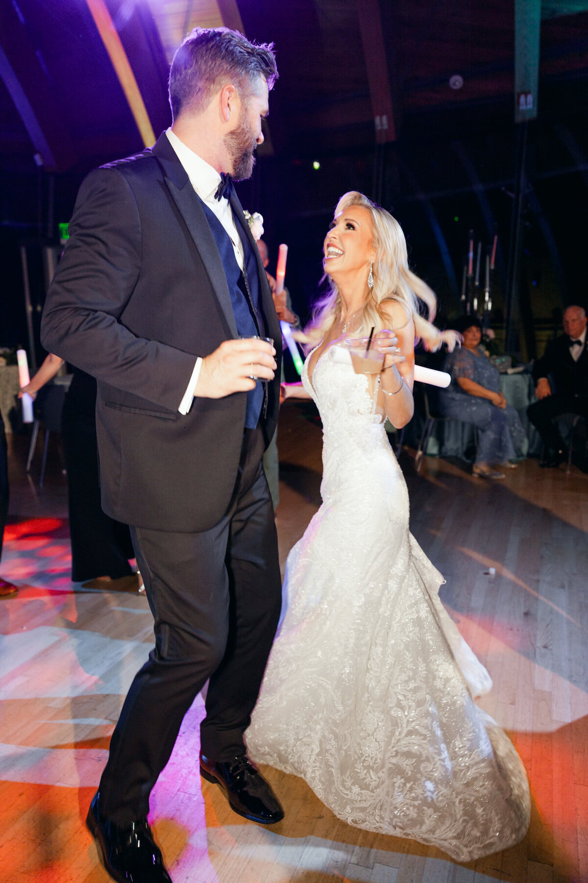 A wedding photo of the bride and groom dancing during their wedding reception at Crystal Bridges Museum of American Art