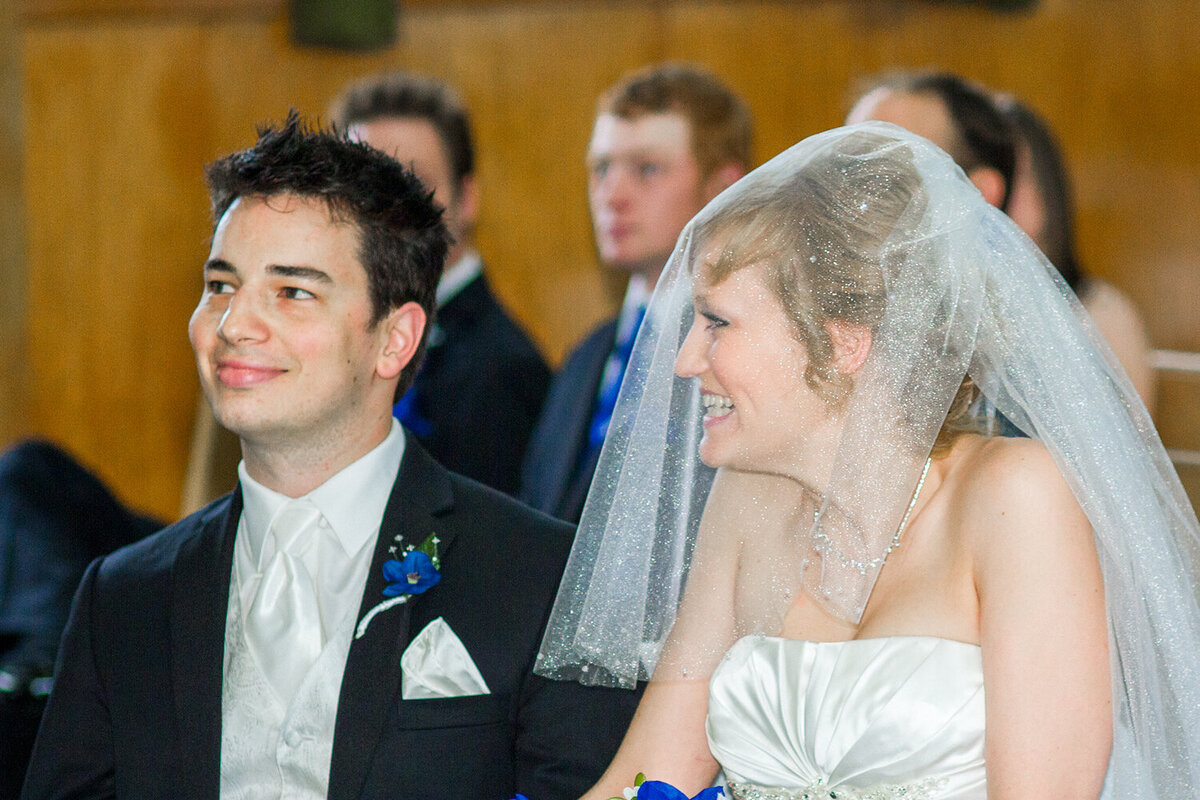 Bride and Groom smiling during ceremony