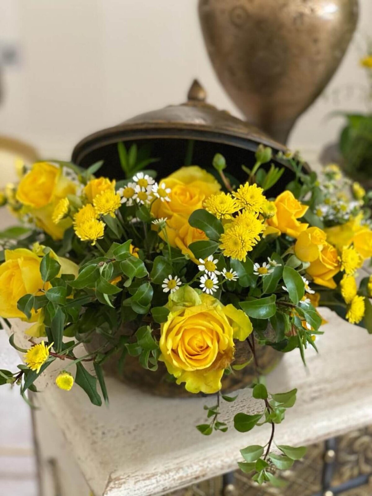 Yellow garden flowers blooming out of a rustic box