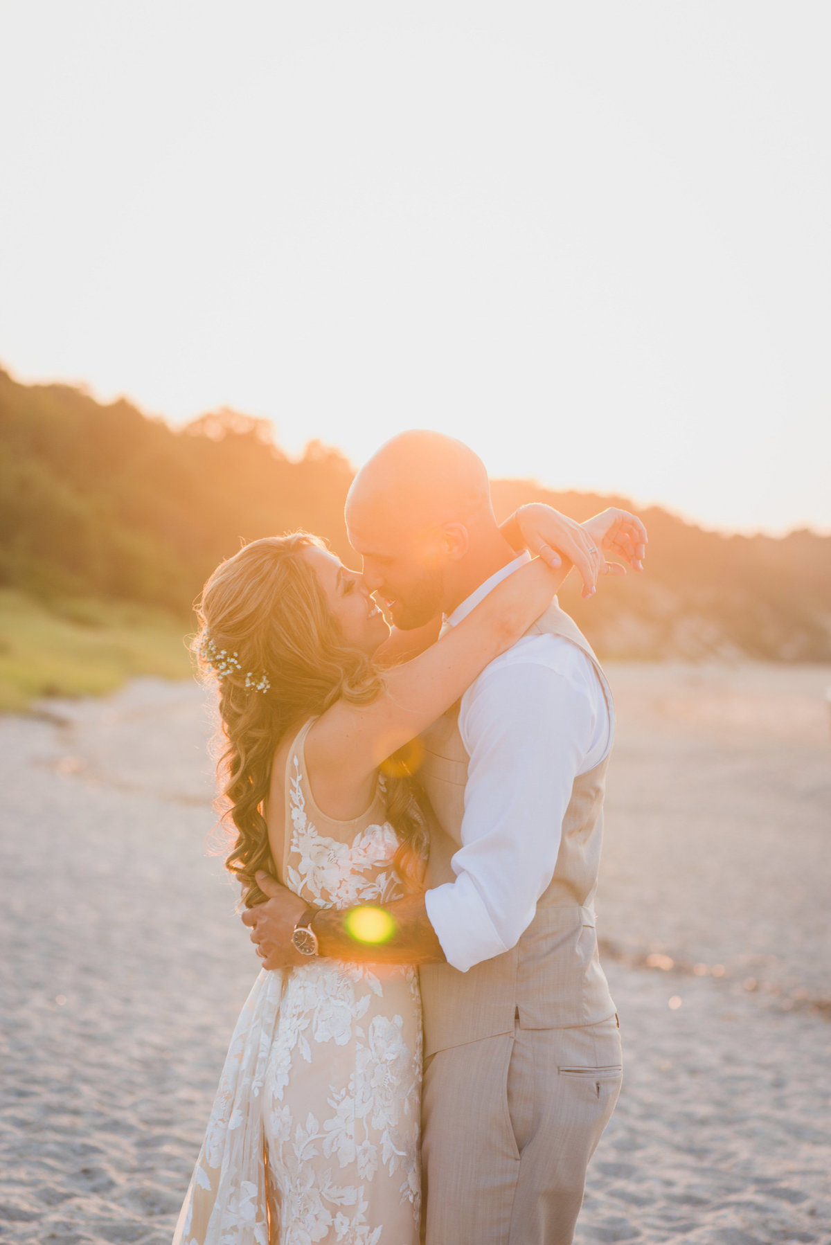 bride and groom on the beach during sunset for wedding at Pavilion at Sunken Meadow