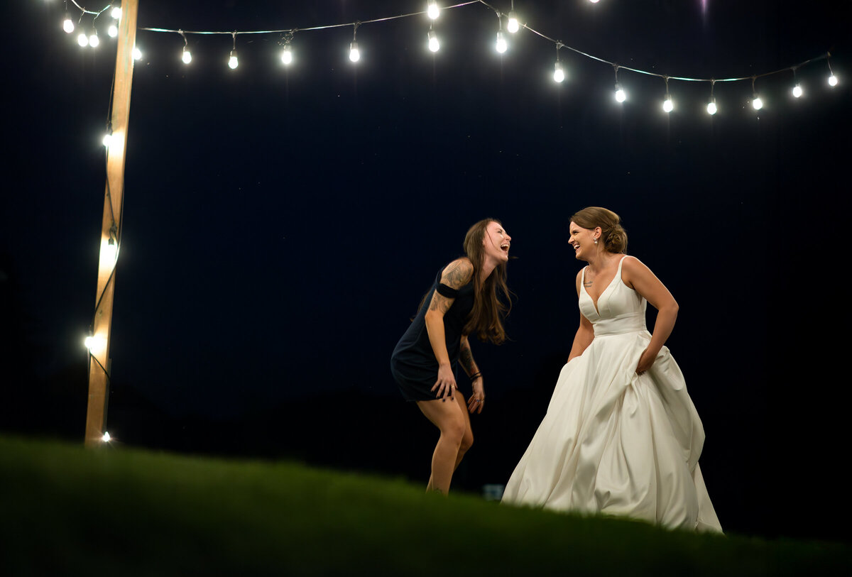 bride and sister dancing