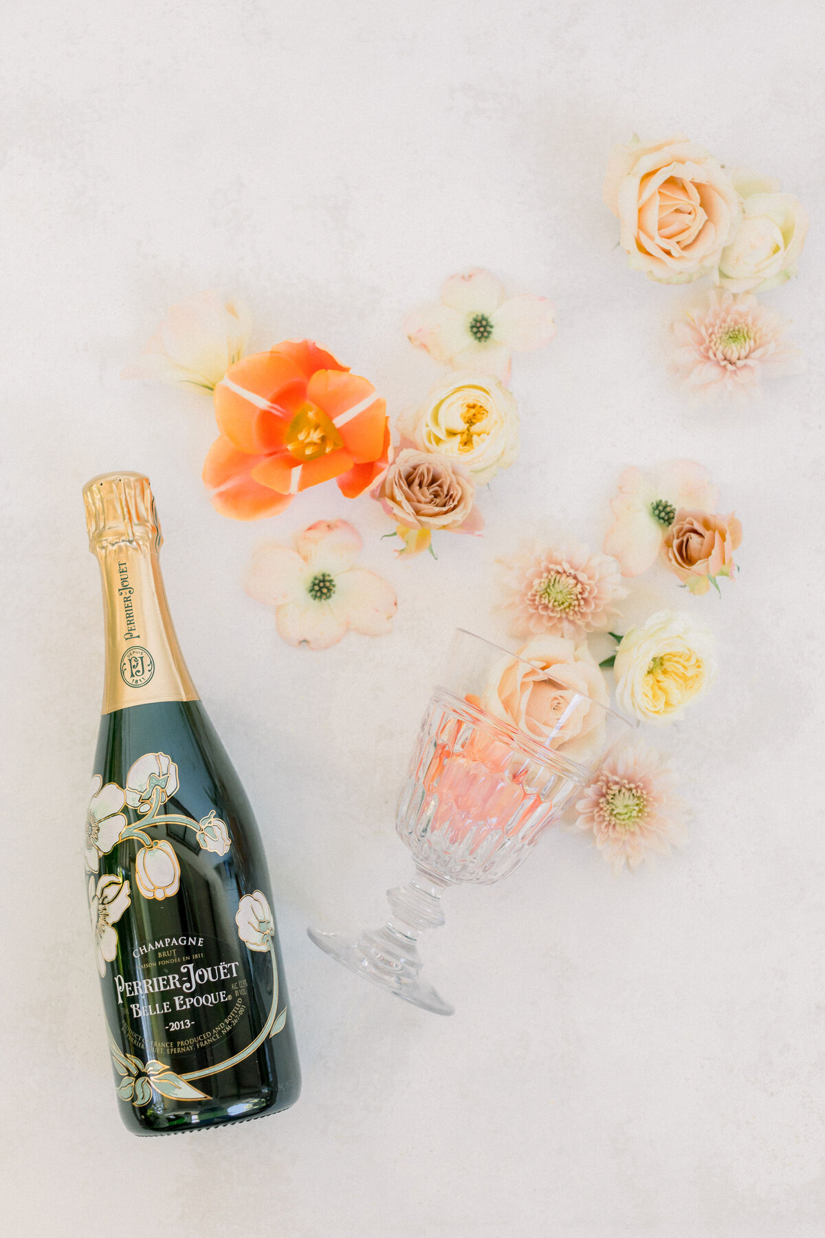 champagne-bottle-floral-arrangement-elegant-still-life