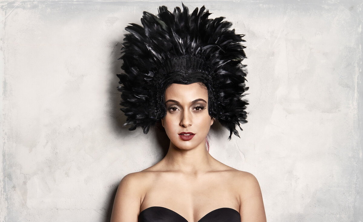 Women musician portrait  Haute Chile wearing black bra black feather headdress